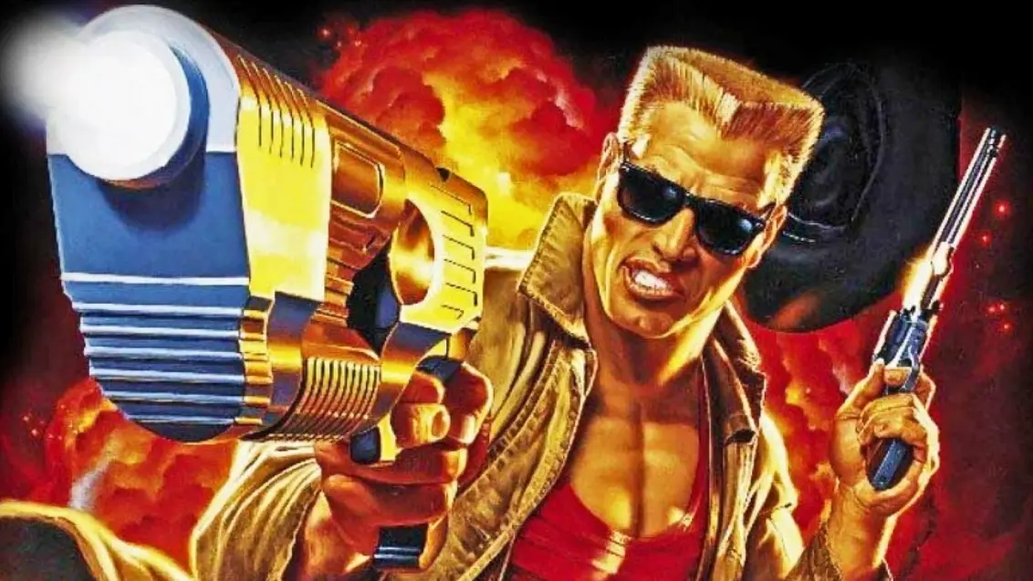 Duke Nukem mit ausgestrecktem Arm, Pistole in der Hand, auf den Bildschirm zielend