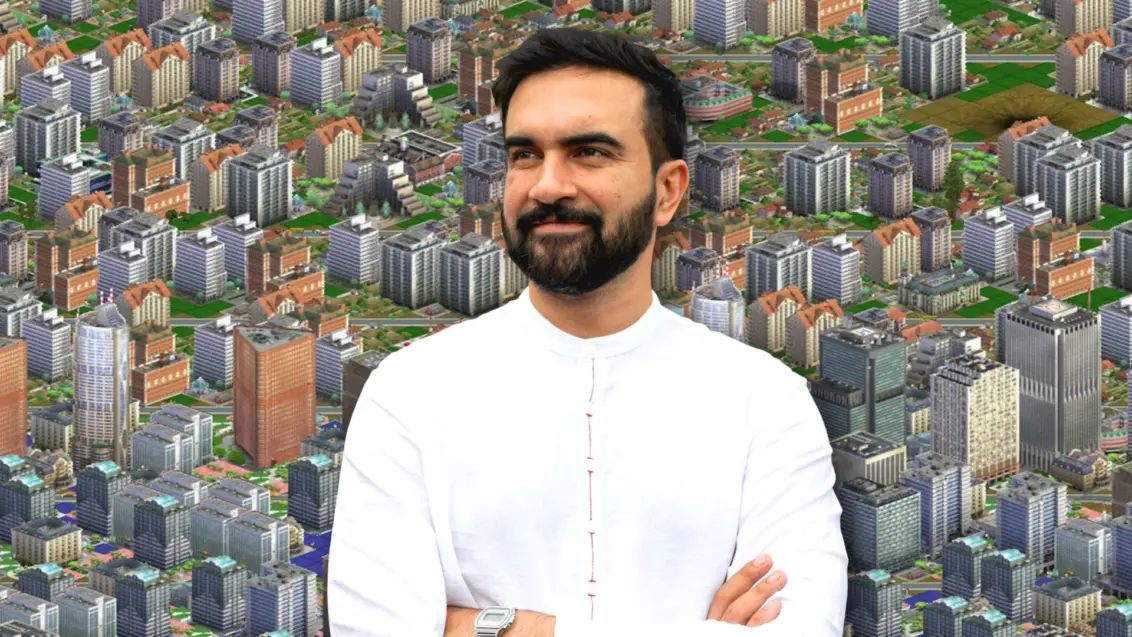 Der Abgeordnete von New York und demokratische Bürgermeisterkandidat Zohran Mamdani vor einem Screenshot aus SimCity 3000.