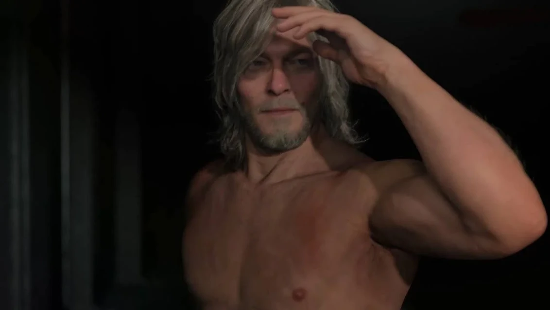 Ein Bild aus dem Trailer von Death Stranding 2, das den oberkörperfreien Norman Reedus zeigt, der seine Augen vor der Sonne schützt.